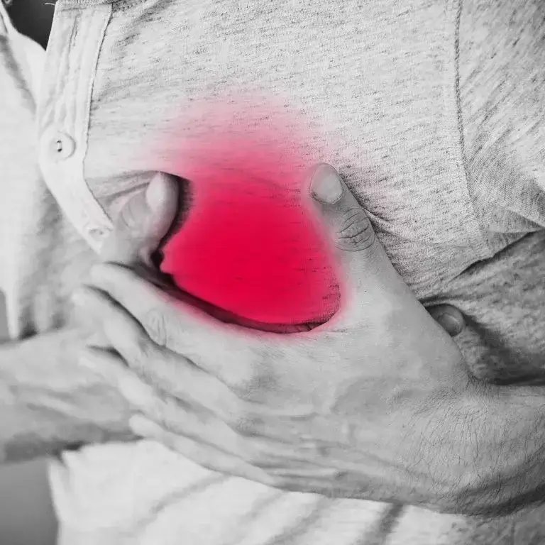 person holding chest in pain