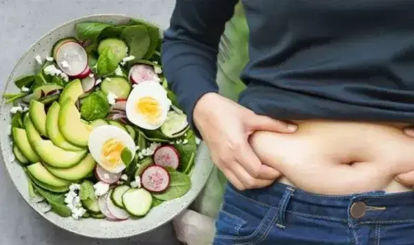 salad bowl next to person pinching belly fat