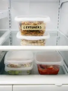 cntainers in a refridgerator marked as leftovers