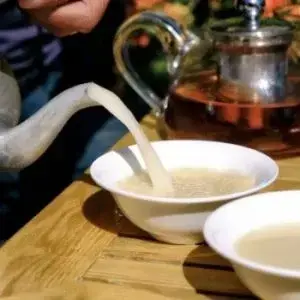 Butter tea pouring into bowls