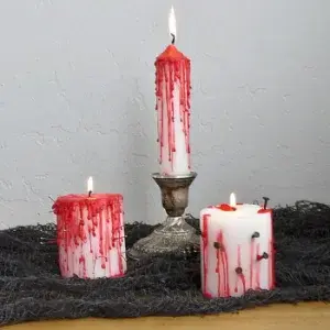 white candles with blood dripping