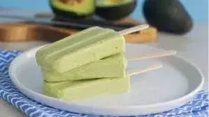 avocado ice pops stacked on plate