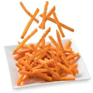 Sweet potato fries falling on a plate